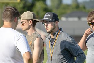 Nathan Ecker/News-Register##Gilgan listens to a player&rsquo;s questions and concerns, welcoming all inquiries as the Tigers face inevitable challenges heading into his first year as head coach.