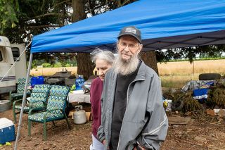 Rusty Rae/News-Register##Patricia Krull and Ronald Hayes of Amity lost their mobile home to an arson fire June 12. They remain on their property in a camper trailer.