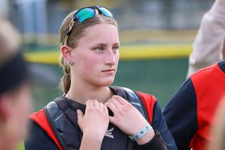 Nathan Ecker/News-Register##Ava Fleischman pays close attention during a postgame huddle while still sporting her catcher s gear. With the need for vocal leaders, Fleischman stepped up in 2026 and took pride in being one of several key faces for Mac&rsquo;s No. 14-ranked ball club.
