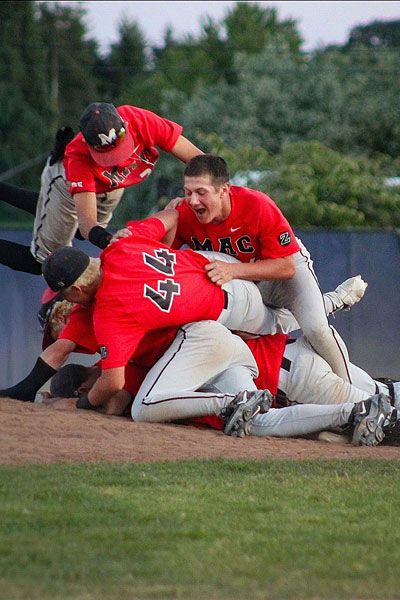 Photo courtesy of Jessie Roberts##A dogpile commences on the back of the mound at West Albany moments after the final out of Mac&rsquo;s championship victory.