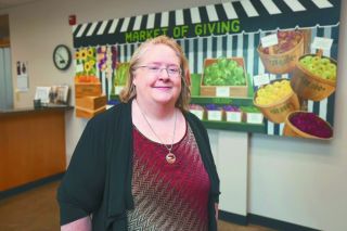 Rachel Thompson/News-Register##New YCAP Executive Director Laverne Pitts stands in the organization&rsquo;s lobby, which was recently reopened to the public at Pitts&rsquo; direction. Building and strengthening relationships are goals for Pitts, she told the News-Register.