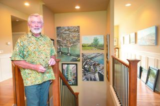 Rusty Rae/News-Register##Phil Juttelstad, surrounded by his paintings of buildings, bridges and cities, talks about how intentionally he has pursued his art since retiring from a career as a project manager. He and his wife, Holly, support the local art scene and are the founders of this weekend&rsquo;s McMinnville Art Festival, at which both will show work.