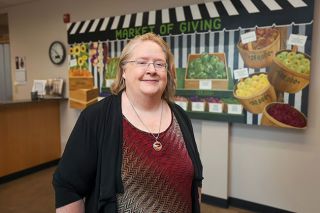 Rachel Thompson/News-Register##New YCAP Executive Director Laverne Pitts stands in the organization&rsquo;s lobby, which was recently reopened to the public at Pitts&rsquo; direction. Building and strengthening relationships are goals for Pitts, she told the News-Register.