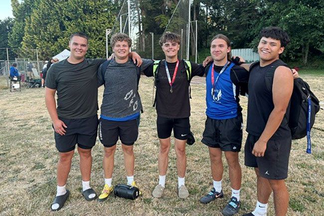 Photo courtesy of Autumn Hayes##Jaxon Howard, McKinley Hayes, Deacon Howard, Billy DeLoe III and Edwin Aldaco pose for a photograph after all having either qualified for nationals or setting a personal record at the USATF Region 13 Junior Olympic Championship at Juanita High School in Washington. Five of the seven Amity Club athletes that qualified are competing in the hammer throw.