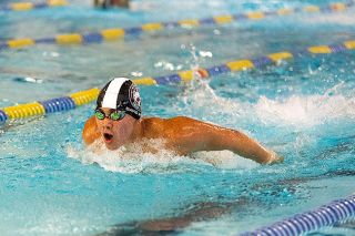 Nathan Ecker/News-Register##Incoming McMinnville High School freshman David Rios lunges forward with a mighty stroke while competing in the boys&rsquo; 11-and-over 200-yard butterfly. Rios won the event with a time of 2:09.10, beating the second-place finisher by four seconds. He also claimed first in the 200-yard backstroke at 2:19.21, less than a second in front of fellow teammate Luke Wilkens (2:20.42). Rios closed a sizeable gap with Wilkens to mark the finish by a hair.