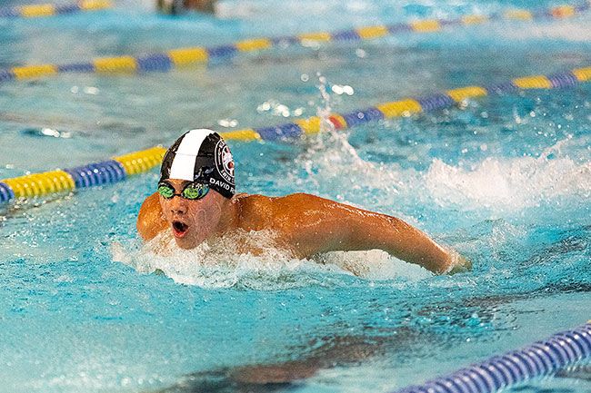 Nathan Ecker/News-Register##Incoming McMinnville High School freshman David Rios lunges forward with a mighty stroke while competing in the boys’ 11-and-over 200-yard butterfly. Rios won the event with a time of 2:09.10, beating the second-place finisher by four seconds. He also claimed first in the 200-yard backstroke at 2:19.21, less than a second in front of fellow teammate Luke Wilkens (2:20.42). Rios closed a sizeable gap with Wilkens to mark the finish by a hair. Nathan Ecker/News-Register##Incoming McMinnville High School freshman David Rios lunges forward with a mighty stroke while competing in the boys’ 11-and-over 200-yard butterfly. Rios won the event with a time of 2:09.10, beating the second-place finisher by four seconds. He also claimed first in the 200-yard backstroke at 2:19.21, less than a second in front of fellow teammate Luke Wilkens (2:20.42). Rios closed a sizeable gap with Wilkens to mark the finish by a hair.
