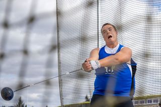 Nathan Ecker/News-Register##Jaxson Howard builds momentum in his hammer toss during an attempt at Amity Thursday Throws on Thursday, July 16. Of all the implements, Jaxson explained that the hammer is one of the most difficult because an athlete is forced to counter the weight of the hammer with their own. With every spin, throwers aim to reach a certain speed and height of their hammer rotation until ready to release on the fourth or fifth orbit.