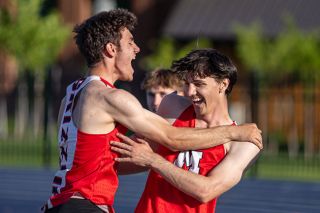Nathan Ecker/News-Register##Joshua Lewis jumps into the arms of his brother, Brian, after the latter completed his Pacific Conference winning 110-meter hurdles race with a time of 14.67 on May 22 at George Fox University&rsquo;s Stoffer Family Stadium. Joshua found Brian within moments of crossing the finish line to celebrate the victory, which was the second time Brian improved on his personal and school record in the event.