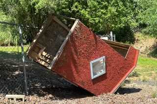 Kirby Neumann-Rea/News-Register##Otherwise sturdy bus shelter is bottoms up on Bell Road.