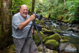 Rusty Rae/News-Register##Gary Thurman enjoys two of his favorite hobbies &mdash; hiking into remote areas and taking photos of waterfalls &mdash; at one of the nearest locations to McMinnville, Baker Creek Falls. Thurman, who has taught photography and won international contests, said there is no wrong way to shoot moving water; it&rsquo;s about what you like.