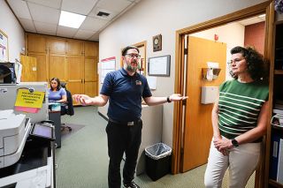 Rachel Thompson/News-Register##Lafayette City Administrator Branden Dross, center, and Administrative Services Manager Jamie Rhodes stand outside of their offices at city hall. In the back, City Recorder Kennedee Harrison sits at her desk in the hallway next to the bathroom. Dross said he must leave the building often to make private or employee-related phone calls. &ldquo;I&rsquo;m very loud. But even if I wasn&rsquo;t so loud, (the walls are) paper thin,&rdquo; he said.