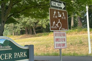 Kirby Neumann-Rea/News-Register##Joe Dancer Park sign provides a roundabout sort of orientation.