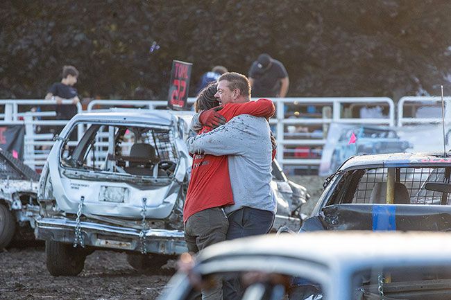 Rachel Thompson/News-Register##Hornet class winner Nathan Conant embraces his grandfather, runner-up Loren Sullenger, after the two outlast the rest of the field.