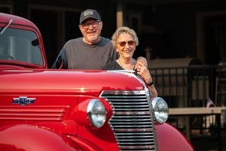 Rusty Rae/News-Register##Paul and Mary Sigrist of McMinnville are the proud owners of the pickup originally owned by the Ivie Hardware store in Sheridan. Paul restored the 1938 Chevy, redoing the fuel system, brakes and other parts and giving it a multi-coat finish in shiny red.