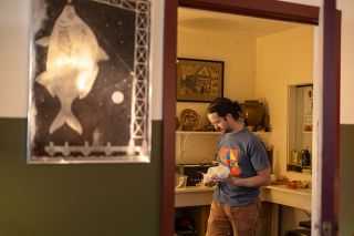 Rachel Thompson/News-Register##Inside the Mac Clay Pottery building, owner Matthew Hawkins checks some of the wine cups he throws on the wheel. Customers can choose from among the slightly different shapes, paint them and have them fired in his kiln.
