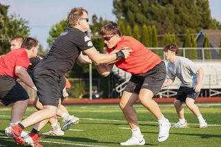 Nathan Ecker/News-Register## Senior lineman Elias Keleher and Daniel Dillworth go at each other in a goalline blocking drill. Keleher was an all-league linebacker and punter for Grizzlies last season, and Dillworth hopes to work with his teammate to create an impenetrable front line and unstoppable defensive attack.