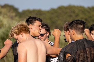 Nathan Ecker/News-Register##Risseeuw breaks down a huddle at the end of practice after providing some words of motivation. Trusting in each other, not getting beat by themselves and keeping their heads held high no matter what were points of discussion as the Bulldogs began the season.