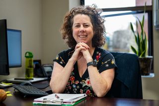 Rusty Rae/News-Register##New McMinnville Parks and Recreation Director Jeanne Sprague sits in her community center office. Sprague started in July and has spent her first month learning about the city from staff and residents. &ldquo;I love to be at events, I&rsquo;ve already been at a couple,&rdquo; she said. &ldquo;I like to help my parks and rec team, and I just enjoy being around people anyway.&rdquo;