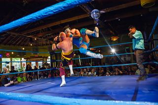 Photo courtesy of Kris Beall##POW Pro Wrestler Jaiden the Unbelievable outmaneuvers (left)  Hot Shot  Spencer Scott in the air and initiates a variation of The Cutter move before the pair slam on the mat. The two wrestlers squared off at the  No Easy Way Out  POW Pro Wrestling event in Eugene on June 20 and will face off again with their tag teams at the  Battle for Lafayette , Sunday, Aug. 30, at Commons Park in Lafayette.