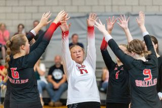 Nathan Ecker/News-Register##McMinnville sophomore Lyndlee Hawley and the Grizzlies celebrate a point won against Newberg at the Newberg Jamboree on Thursday, Aug. 27. Playing with focus and energy are keys that Mac players believe will make them a formidable foe this season.