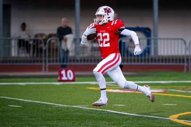 Rusty Rae/News-Register##Sophomore Bradley Woodward streaks down field on his 96-yard kickoff return to swing momentum back in the Grizzlies favor during their 34-22 victory over Beaverton on Friday, Sept. 4, at Wortman Stadium.