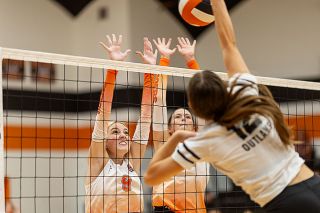 Rachel Thompson/News-Register##Yamhill Carlton senior Ambrie Slaughter extends over the net to block a shot from Sisters&rsquo; junior Helene Voigt on Thursday, Sept. 3, in the Tiger Dome. The Tigers were forced to meet their opponents pace and energy, in the process learning not to leave anything in the tank as they tangoed with a perennial playoff contender.