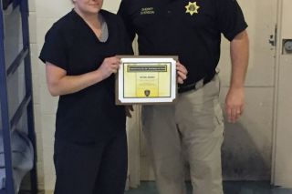 Submitted photo##Yamhill County Jail inmate Chrystal Harmes and Sheriff Tim Svenson.