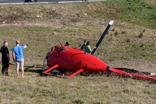 Photos courtesy Newberg-Dundee Police Department##The pilot and passenger - brothers - were uninjured when their helicopter crashed Sunday afternoon in rural Newberg.