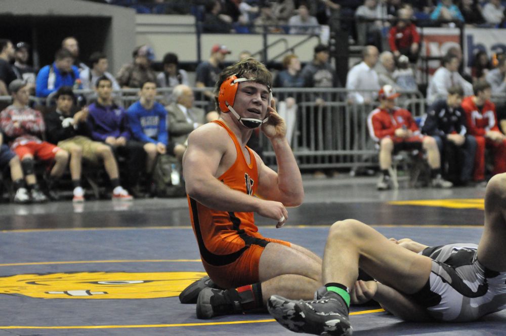 Robert Husseman/News-Register##Austin Howard of Willamina (in orange) reacts after defeating Garrett DeVos of Vale, 10-3, in the Class 3A 170-pound state championships final.