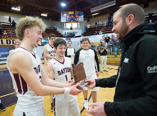 Marcus Larson/News-Register##
Dayton s Lukas Findley and Braeden Nowlin accept the 3rd place OSAA 3A basketball State tournament trophy at the conclusion of Saturday s morning game.