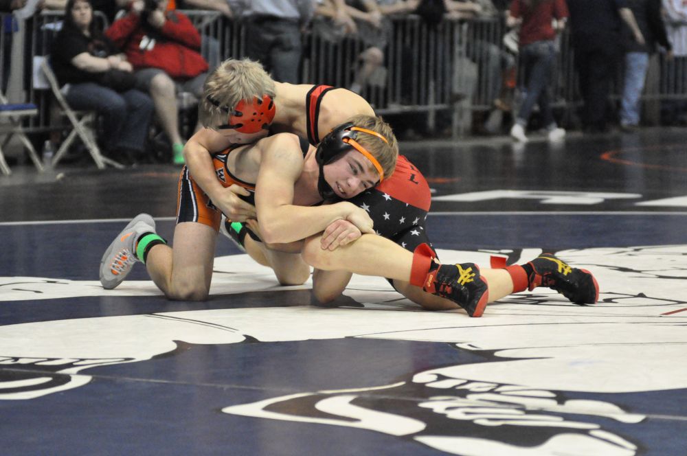 Robert Husseman/News-Register##Willamina sophomore Ethan Howard (in black) counters a move by Creswell sophomore Blaine Rodolf. Rodolf won Friday s 3A 120-pound match by fall (3:04), but Howard wrestled back into the consolation semifinals, where he will begin Saturday.