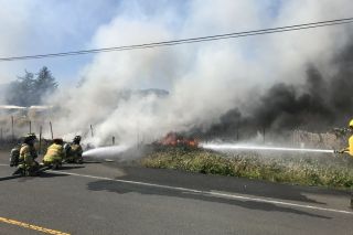 Photos courtesy Sheridan/Southwest Polk/West Valley fire districts##A storage yard and outbuildings burned along Highway 18 in Grand Ronde Wednesday afternoon. Photos courtesy Sheridan/Southwest Polk/West Valley fire districts##A storage yard and outbuildings burned along Highway 18 in Grand Ronde Wednesday afternoon.