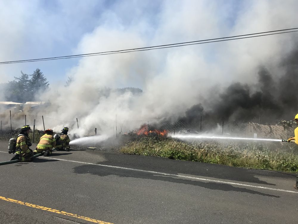 Photos courtesy Sheridan/Southwest Polk/West Valley fire districts##A storage yard and outbuildings burned along Highway 18 in Grand Ronde Wednesday afternoon.