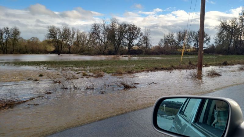 Photo submitted by Kent Roerig##Baker Creek spilling over its banks near Hill Road Monday afternoon after the rains stopped.