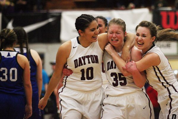 Rockne Roll/News-Register##
From left, Dayton s Kalina Rojas, Teddi Hop and Shawnie Spink celebrate their OSAA State Championship game victory over the Amity Warriors at Marshfield High School in Coos Bay on Saturday, March 5.