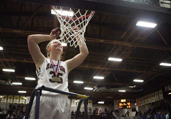 Rockne Roll/News-Register##
Dayton senior Teddi Hop cuts down the net in celebration after the Dayton Pirates  OSAA State Championship game win over Amity at the Pirate Palace in Coos Bay on Saturday, March 5.