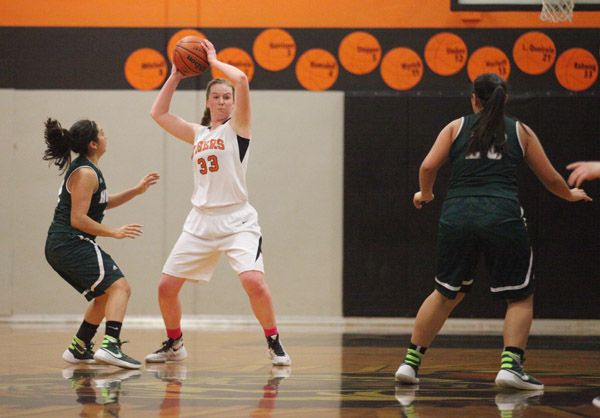 Rockne Roll/News-Register##
Y-C s Megan Gaibler (33) looks for a pass out of a full-court press in the Tiger s game against North Marion at Barnett Court in Yamhill on Friday, Feb. 5.