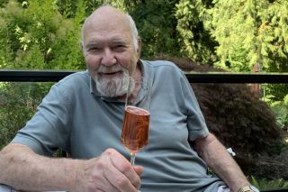 Submitted photo##Dick Erath, who died Wednesday, sips a glass of his sparkling wine, which he continued to make for his family after selling his winery. He also made a barrell of Pinot noir each year, his stepdaughter said.