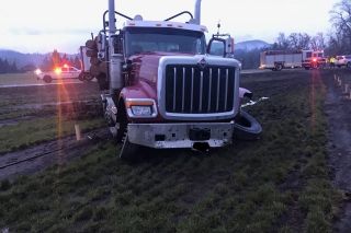 Southwest Polk Fire District photo##A Grand Ronde woman was killed Tuesday morning when the car she was driving collided with a loaded log truck on Highway 22 in Polk County.