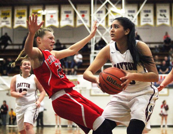 Rockne Roll/News-Register##
Dayton s Kalina Rojas (in white) collides with Coquille s Kyra Howard in Friday s OSAA State Championship semifinal between the schools Friday, March 4 at the Pirate Palace in Coos Bay.