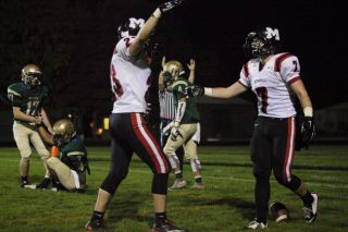Rockne Roll/News-Register##Jesse Medley (7) and Justin Trimble (23) celebrate Medley’s second receiving touchdown of the night Friday evening in McMinnville s 28-7 victory over McKay. Rockne Roll/News-Register##Jesse Medley (7) and Justin Trimble (23) celebrate Medley’s second receiving touchdown of the night Friday evening in McMinnville s 28-7 victory over McKay.