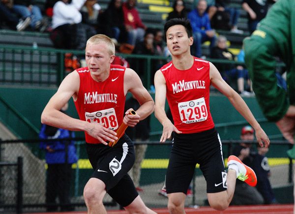 Rockne Roll/News-Register##Trustian Skeffington (left) receives the baton from Jerry Liu during McMinnville s performance in the 6A boys 4x400-meter relay Saturday. Rockne Roll/News-Register##Trustian Skeffington (left) receives the baton from Jerry Liu during McMinnville s performance in the 6A boys 4x400-meter relay Saturday.