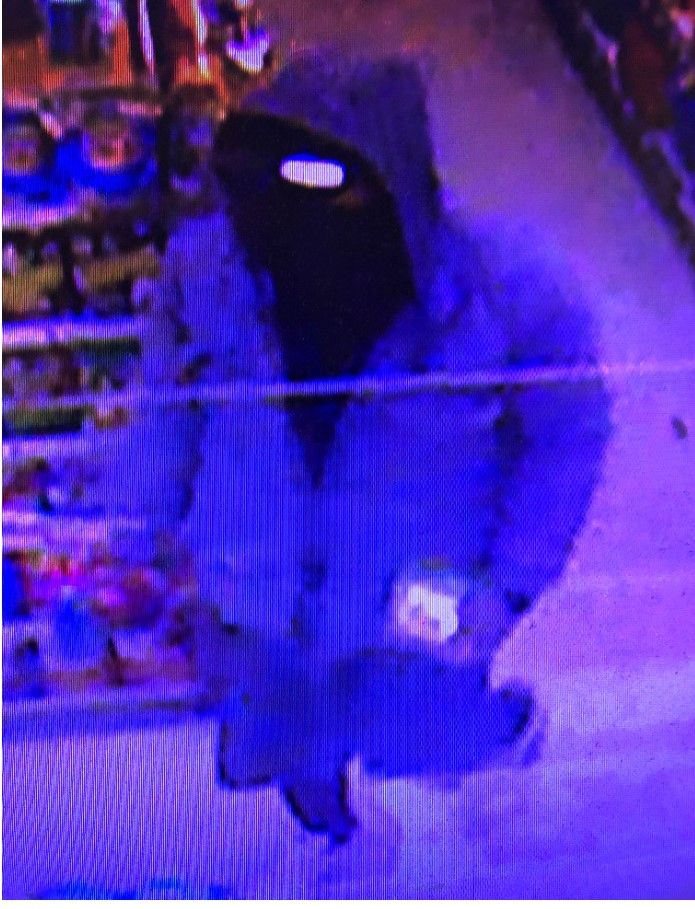 Courtesy of the McMinnville Police Department##Surveillance photo of the subject who robbed the 7-Eleven across Southwest Baker Street from Linfield University Thursday night.