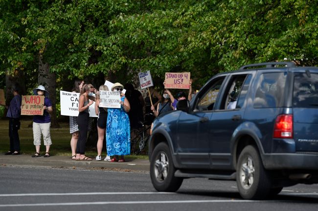 Sign-carrying protestors made their presence felt at Linfield.