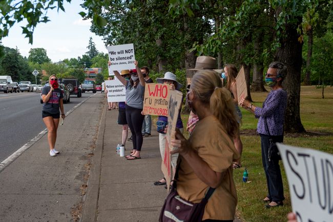 Rusty Rae photos##Linfield University senior Hannah Waterman, with the megaphone, helped organize Thursday s sexual violence protest.