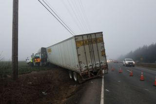 Oregon State Police photos##A Washington state truck driver suffered a heart attack that resulted in a two-vehicle crash just south of Dundee early Wednesday morning. He was pronounced dead at the hospital.