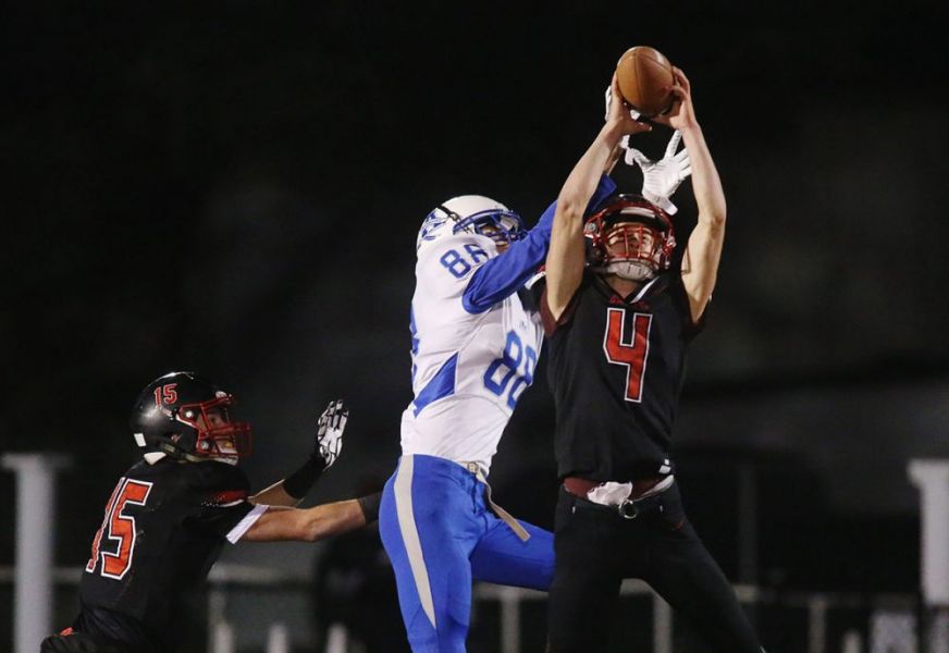 Rockne Roll/News-Register##
Amity s Tommy Jackson (88) contests a pass thrown for Santiam Christian s Ivan GIlder during the Warriors  48-27 loss.