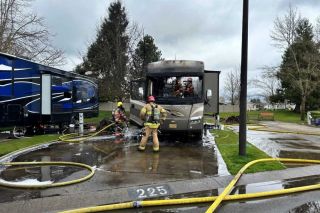 Photo courtesy McMinnville Fire Department##Firefighters extinguished a blaze that gutted a recreational vehicle at Olde Stone Village on Highway 18 Monday morning.
