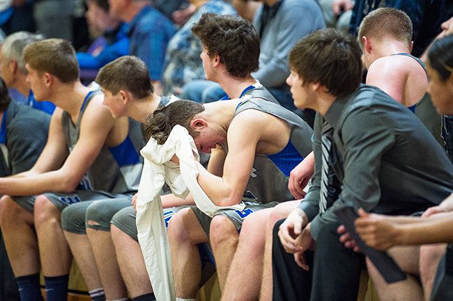 Marcus Larson/News-Register##
Amity s Michael Duncan is dejected in the closing minutes of the Warriors  loss to De La Salle North Catholic.