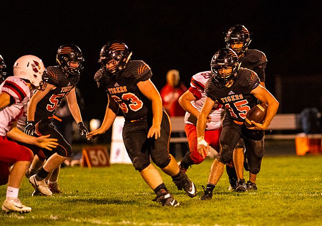 Rusty Rae/News-Register##
Yamhill-Carlton running back Owen Amerson (15) breaks off a big run against Corbett.